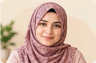 Sara Ma'am, in a patterned hijab, smiling at the camera